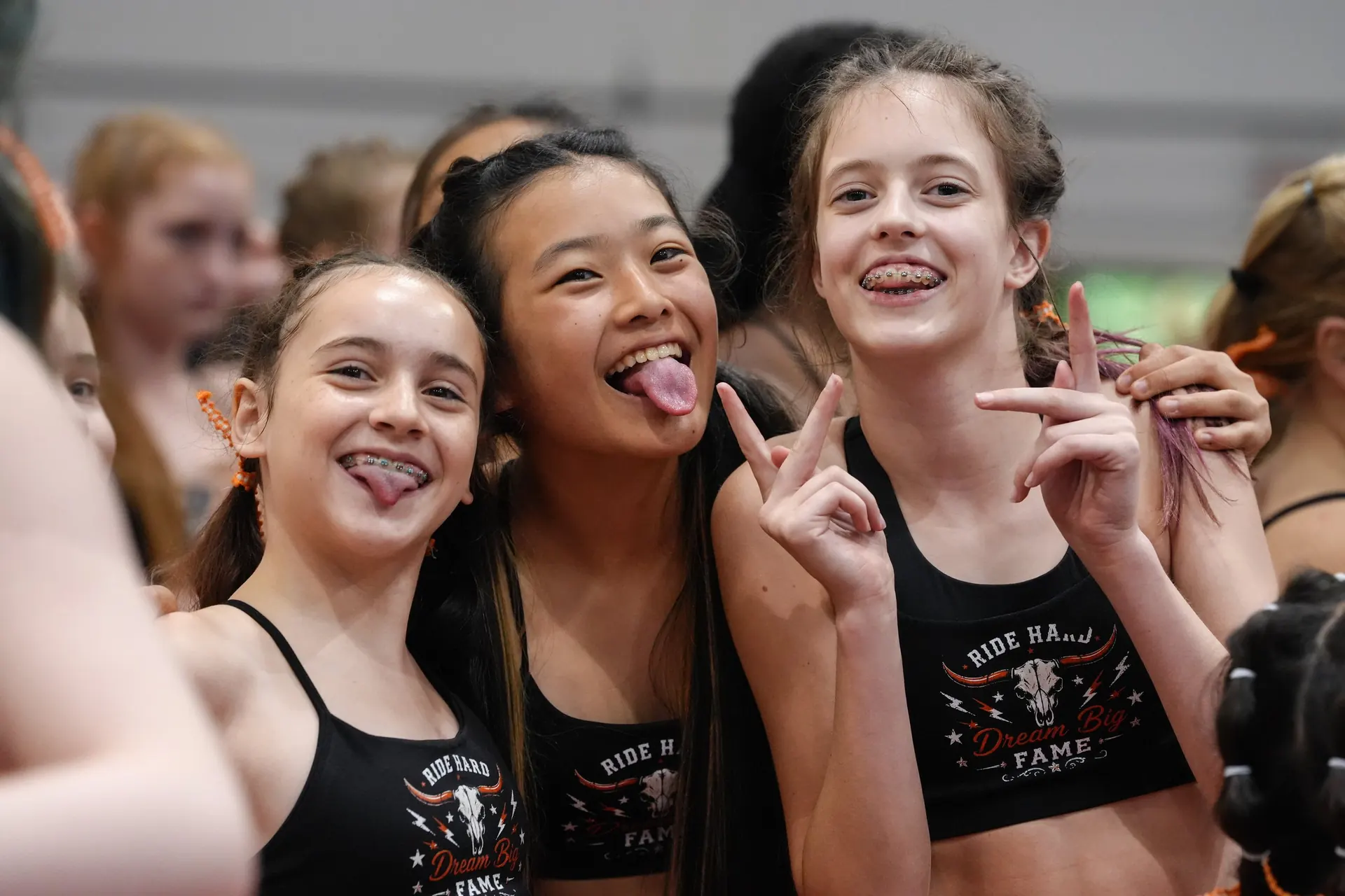 Friends making silly faces at camp